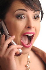 Image showing screaming pretty sexy young woman with cellphone