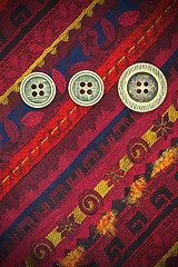 Image showing vintage tape with embroidered ornaments and old buttons