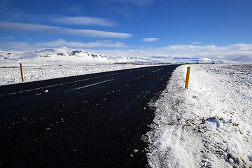 Image showing Wet road with impressive landscape 