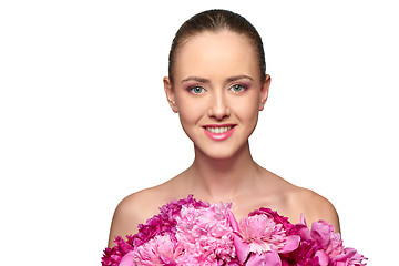 Image showing Beautiful girl with pink peony flowers