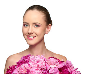 Image showing Beautiful girl with pink peony flowers