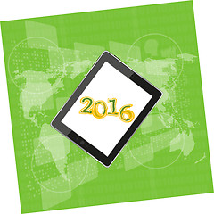 Image showing tablet pc or smart phone on business digital touch screen, world map, happy new year 2016 concept