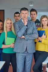 Image showing group portrait of teacher with students