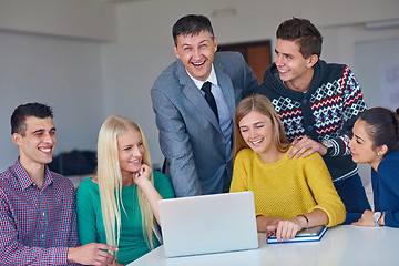 Image showing group of students getting suppport from teacher