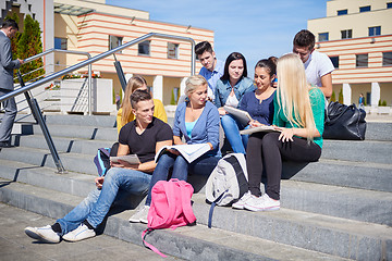 Image showing students outside sitting on steps