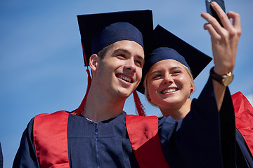 Image showing students group in graduates making selfie