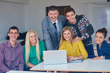 Image showing group of students getting suppport from teacher