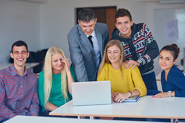 Image showing group of students getting suppport from teacher