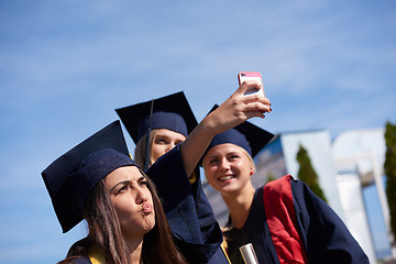 Image showing students group in graduates making selfie