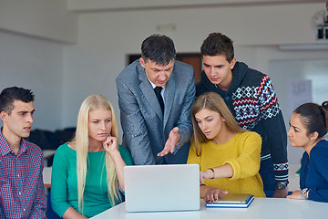 Image showing group of students getting suppport from teacher