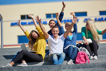 Image showing students outside sitting on steps