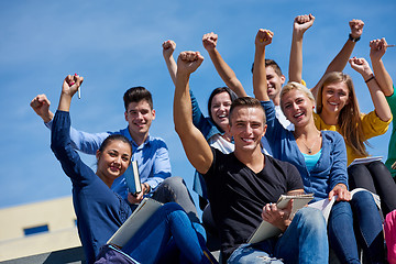 Image showing students outside sitting on steps