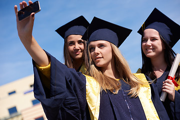 Image showing students group in graduates making selfie