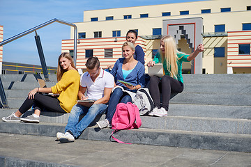 Image showing students outside sitting on steps