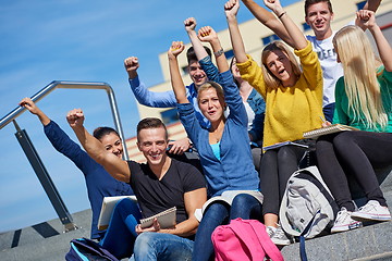 Image showing students outside sitting on steps