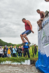 Image showing Sportsmen jumps in water. Steel Character. Tyumen