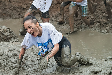 Image showing Attractive girl in extrime racing in mud hole