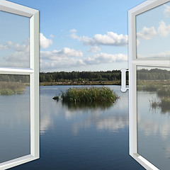 Image showing opened window to the summer lake