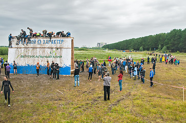 Image showing Teams storm big wall in extrim race. Tyumen.Russia