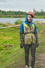 Image showing Attractive girl in extrime racing waits own team