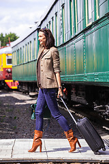 Image showing beautiful adult woman with a luggage
