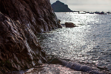 Image showing sunset near ancient cliff, marine landscape