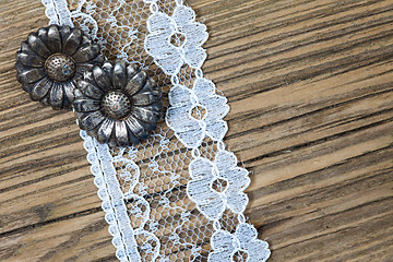 Image showing vintage button and lace tape