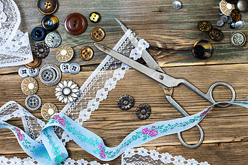 Image showing buttons, lace, tape and a dressmaker scissors