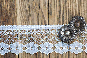 Image showing vintage button and lace tape