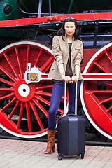 Image showing Travel portrait of a beautiful adult woman with luggage