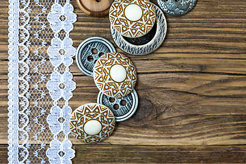 Image showing several vintage buttons and lace tape