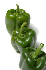 Image showing three green peppers vertical