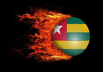 Image showing Flag with a trail of fire - Togo