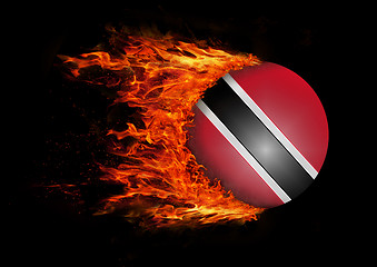 Image showing Flag with a trail of fire - Trinidad and Tobago