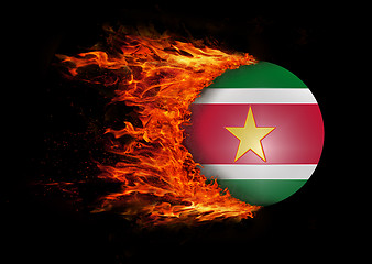 Image showing Flag with a trail of fire - Suriname