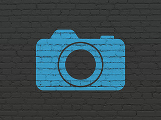 Image showing Vacation concept: Photo Camera on wall background