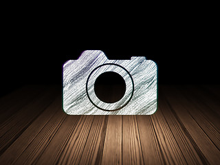 Image showing Vacation concept: Photo Camera in grunge dark room