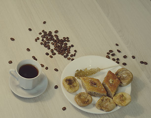 Image showing baklava, coffee and dried figs on the table