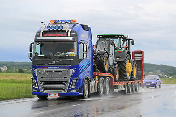 Image showing Volvo FH16 Truck Hauls John Deere Machinery