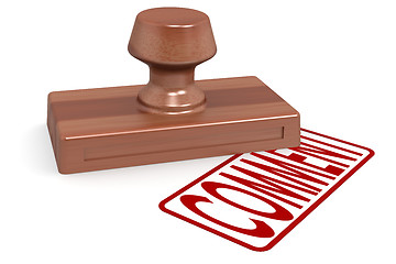 Image showing Wooden stamp comment with red text