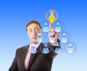 Image showing Manager Selecting A Male Worker Atop A Pyramid