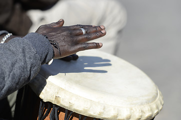 Image showing hands of musician playing the tomtoms