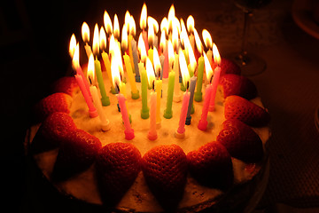 Image showing birthday strawberry cake with lighted candles