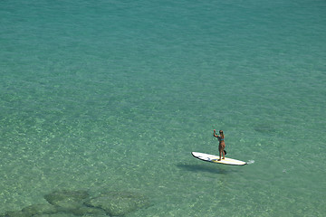 Image showing Stand-up paddle in a crystalline sea beach in Fernando de Noronha,Brazil