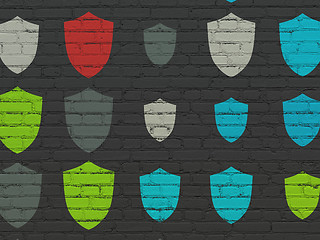 Image showing Security concept: Shield icons on wall background