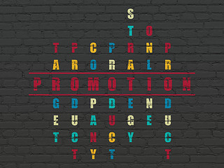 Image showing Advertising concept: word Promotion in solving Crossword Puzzle