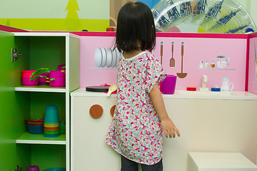 Image showing Chinese children role-playing at kitchen