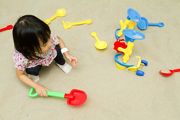Image showing Chinese children playing at indoor sandbox.