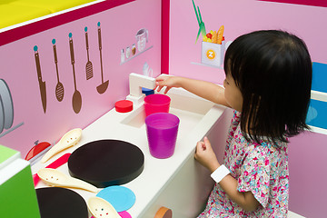 Image showing Chinese children role-playing at kitchen