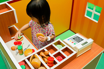 Image showing Chinese children role-playing at burger store.